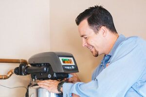 water softener maintenance being performed by a technician