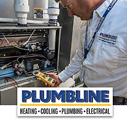 A heating tech checking a furnace