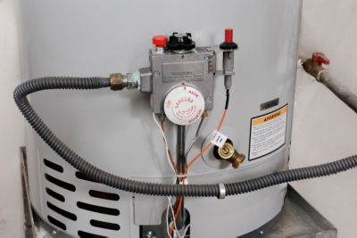 Water temperature controls on a hot water heater that is whistling