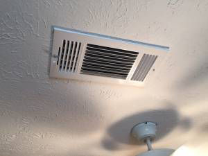 Open supply vent in ceiling