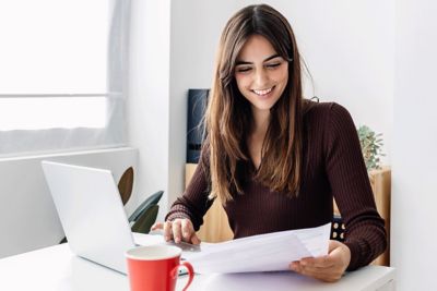 Woman looking at her energy bill