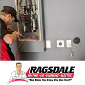 Electrician repairing an electrical panel