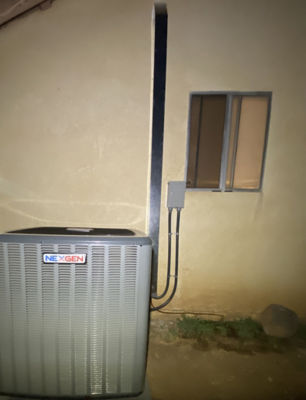 An AC unit connected to a building.