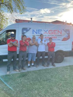 5 men making x's with their arms in front of Nexgen truck