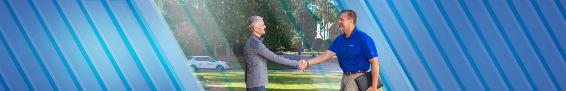 Woman and man shaking hands in front of home