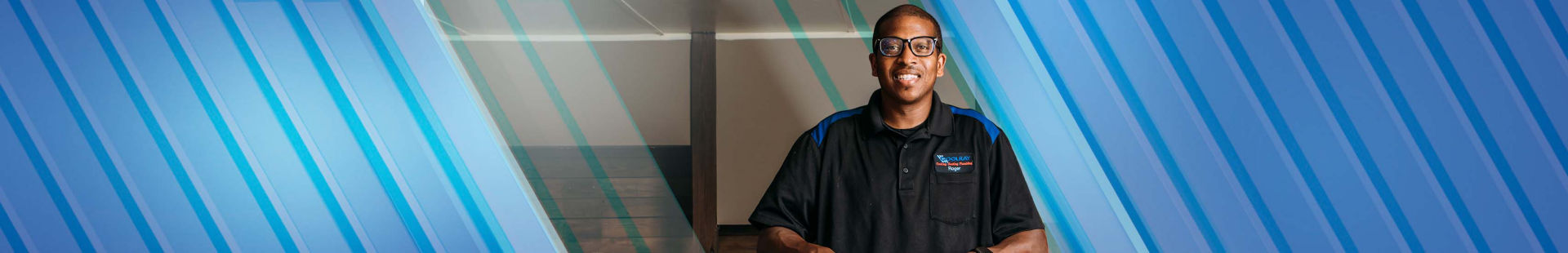 Man smiling with Coolray work shirt