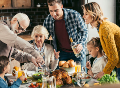 Family around the table eating and talking.