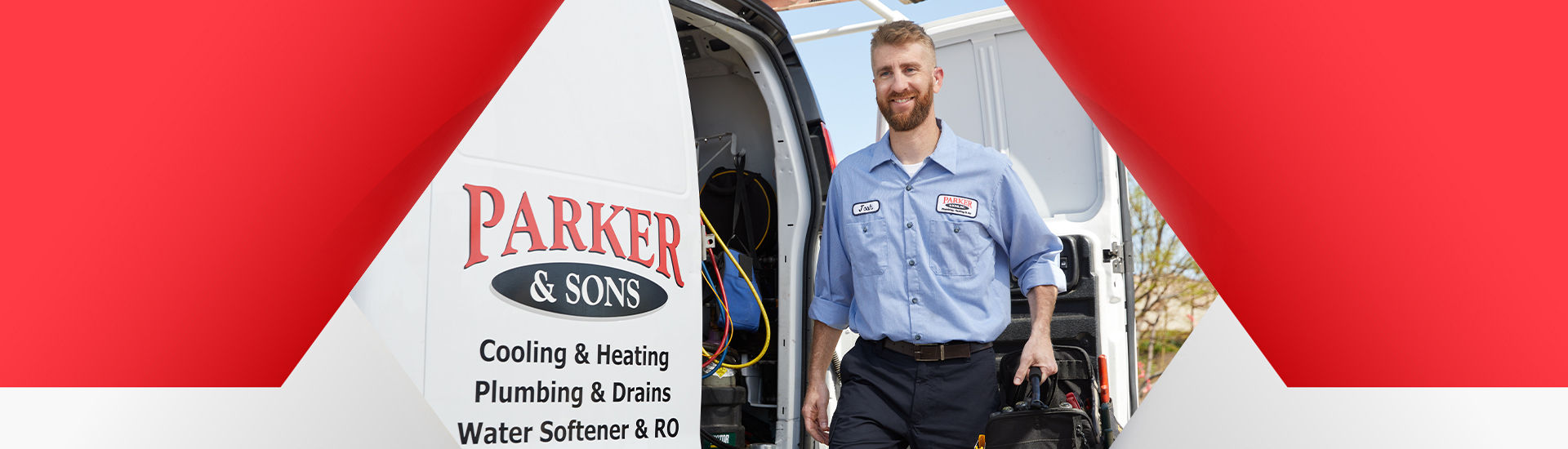 Technician pushing new water heater on dolly