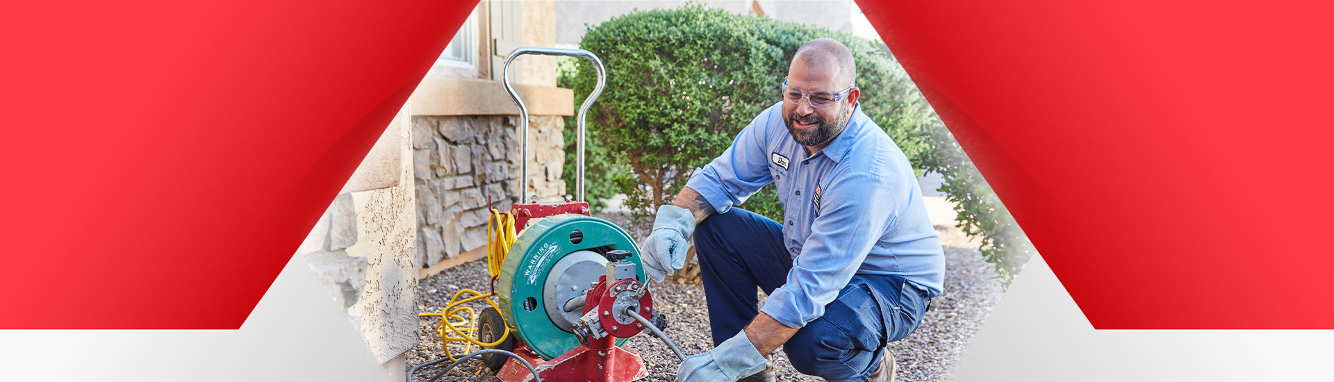 Technician jetting a drain and sewer system