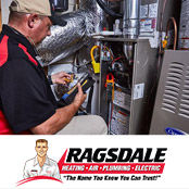 Ragsdale technician repairing an HVAC system in a Roswell, GA home