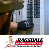 Electrician inspecting an electrical panel