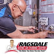 A Ragsdale plumber repairing a water heater