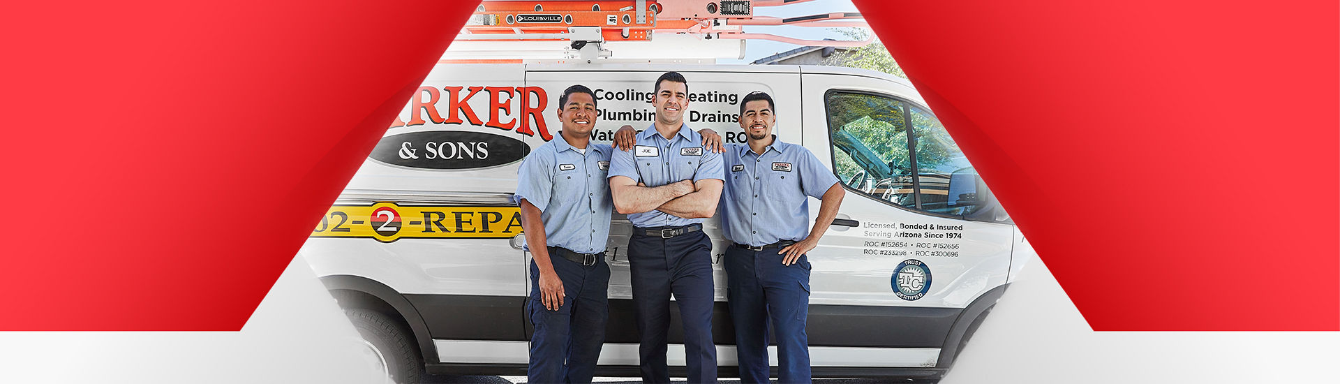 Parker & Sons technicians standing in front of a service vehicle