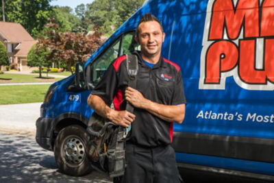 Mr. Plumber technician getting ready to perform sewer line camera inspection at an Atlanta area home