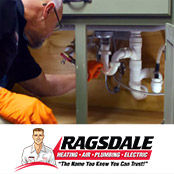 Ragsdale plumber inspecting a kitchen sink drain