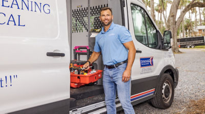 Technician running diagnostics on ac unit 