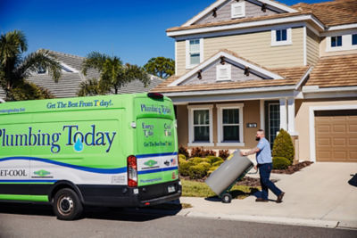 Plumber delivering a new water heater in Valrico