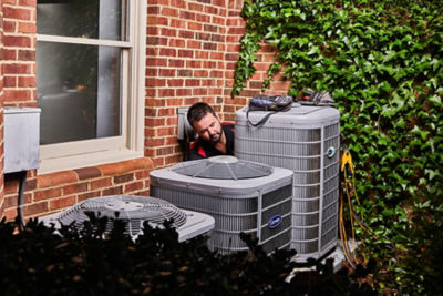 Technician from Ragsdale inspecting an AC unit