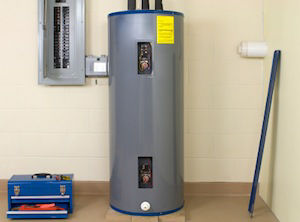 Traditional water heater in closet next to blue toolbox