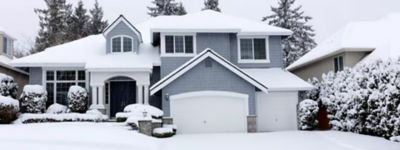 Front view of falling snow with home during rare storm in Pacific Northwest of United States